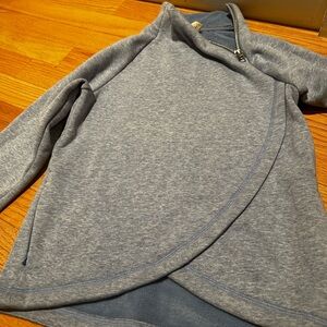 Blue Athleta Girl sweater.